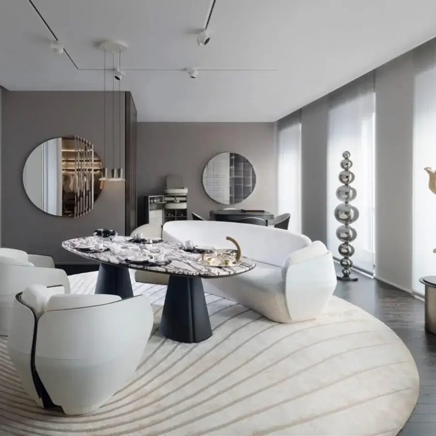 Elegant Giorgetti Floria lounge table with sculpted form and polished marble displaying grey and white veining with curved leather legs