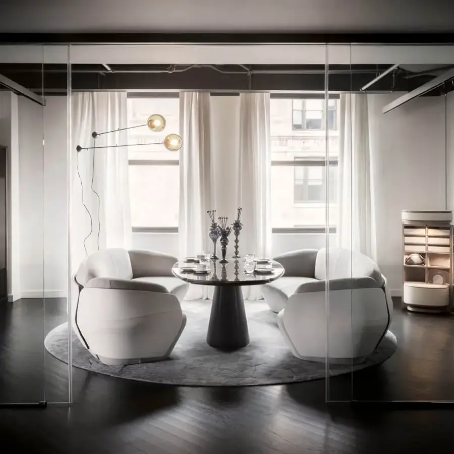 Refined Giorgetti Floria lounge table with clear glass top and dark leather legs displaying subtle engravings