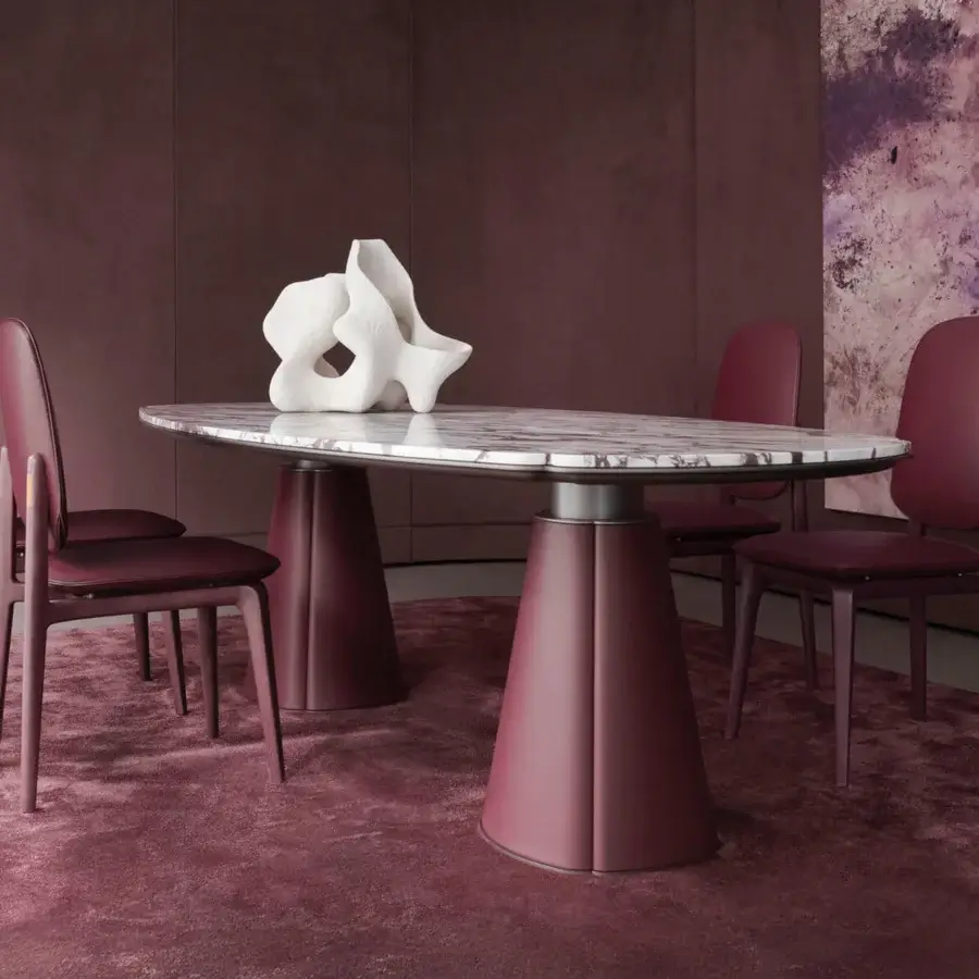 Elegant Giorgetti Floria table with polished marble top exhibiting grey veining and reddish-purple matte leather base crafted with milled corners