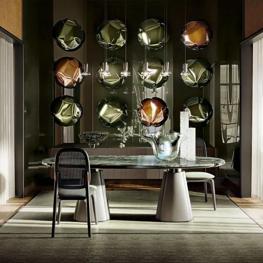 Distinguished Giorgetti Floria table with dark green and grey veined marble top and grey leather-finished pedestal base