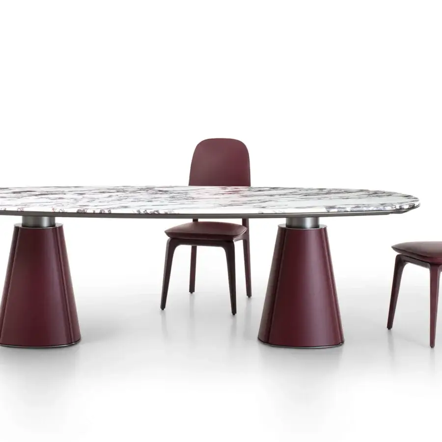Elegant Giorgetti Floria table with reddish-brown veined marble top and deep burgundy leather legs crafted with refined milling