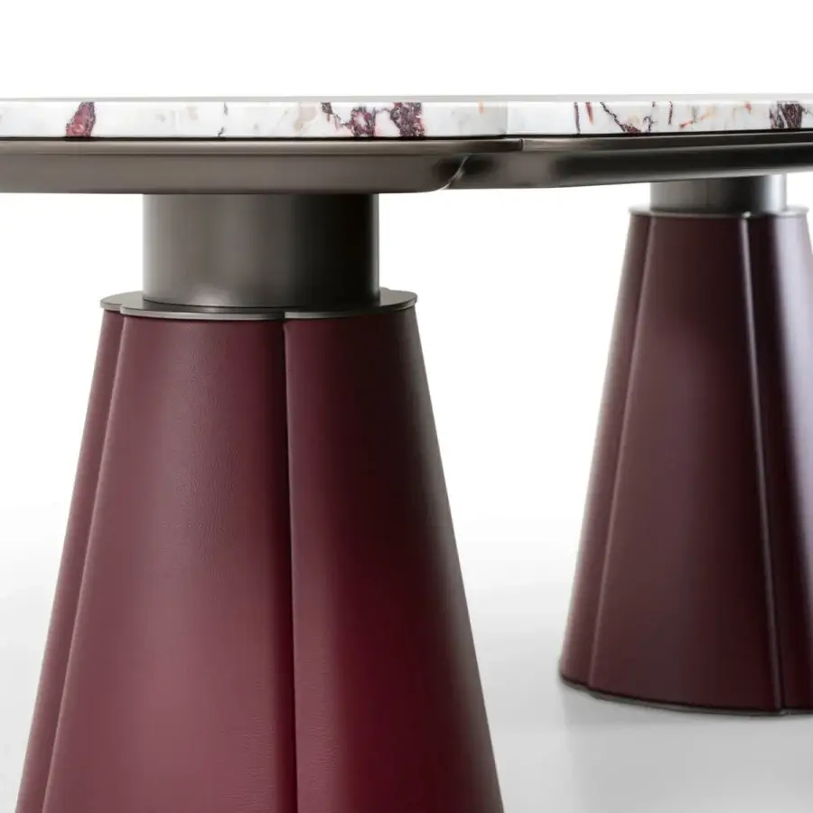 Distinguished Giorgetti Floria table with reddish-brown veined marble and burgundy leather-covered sculpted legs crafted in a balanced design