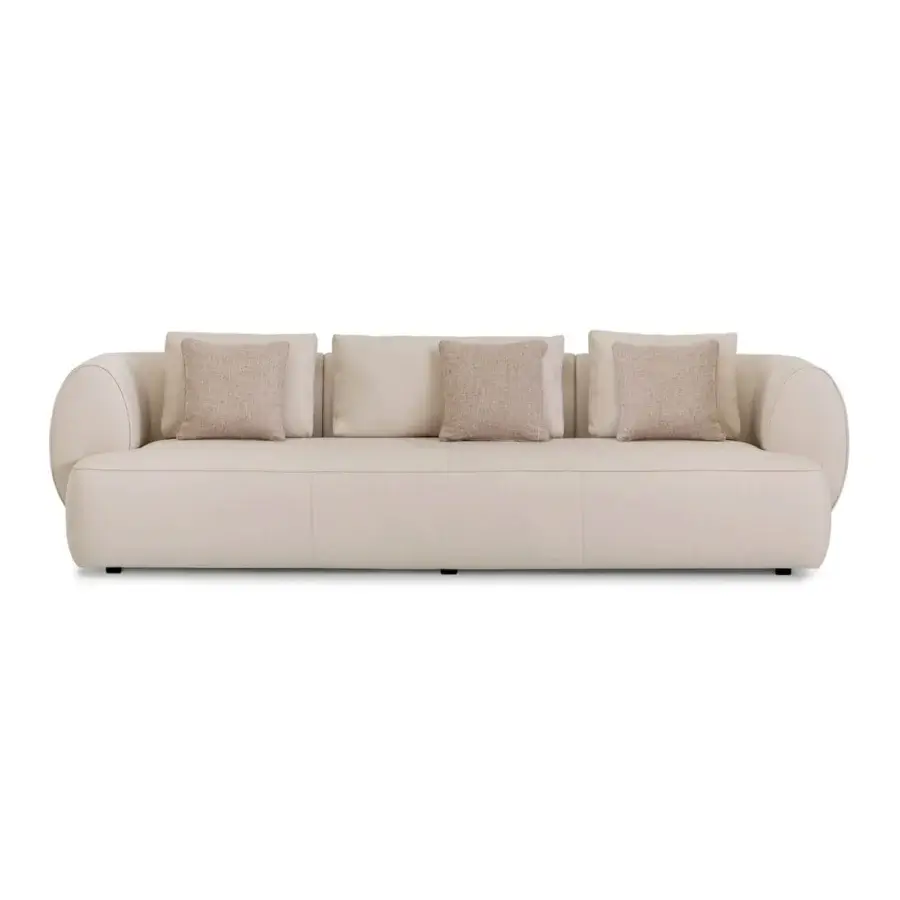 Lavish Sicis Botero sofa with a low wide organically curved silhouette in contemporary neutral beige textile and robust timber frame