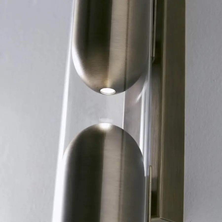 Exceptional Penta Clash wall lamp with transparent glass encasing distinctive brushed bronze metal elements and a refined finish