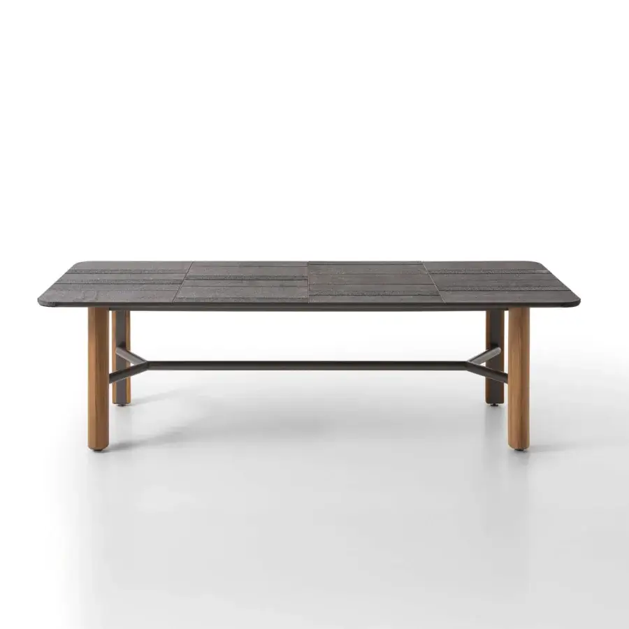 Superior Giorgetti Moorea table with Etna lava stone, pearl-colored glass powder, pewter painted stainless steel, and solid teak wood legs