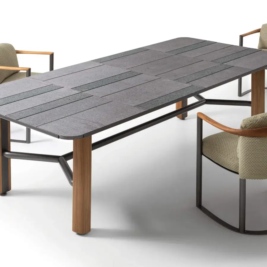 Distinguished Giorgetti Moorea table crafted with dark gray Etna lava stone, pearl glass powder, teak wood legs and pewter stainless steel frame