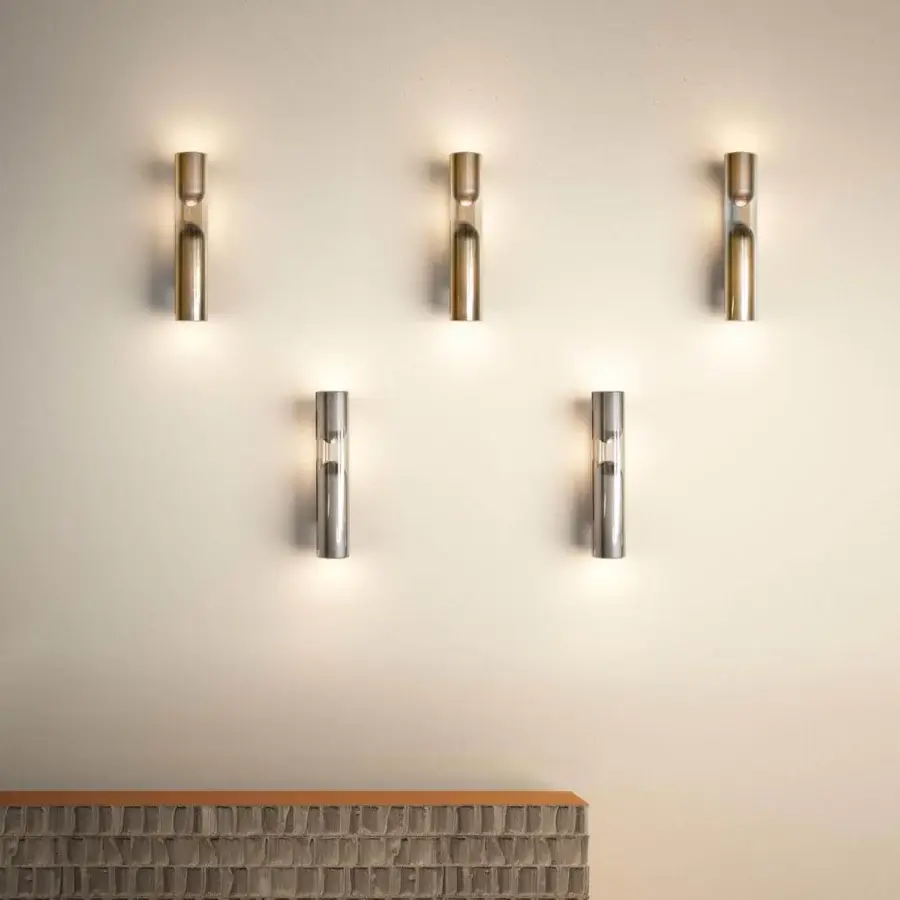 Superior Penta Clash wall lamp uniting clear glass with a U-shaped brushed bronze metallic element