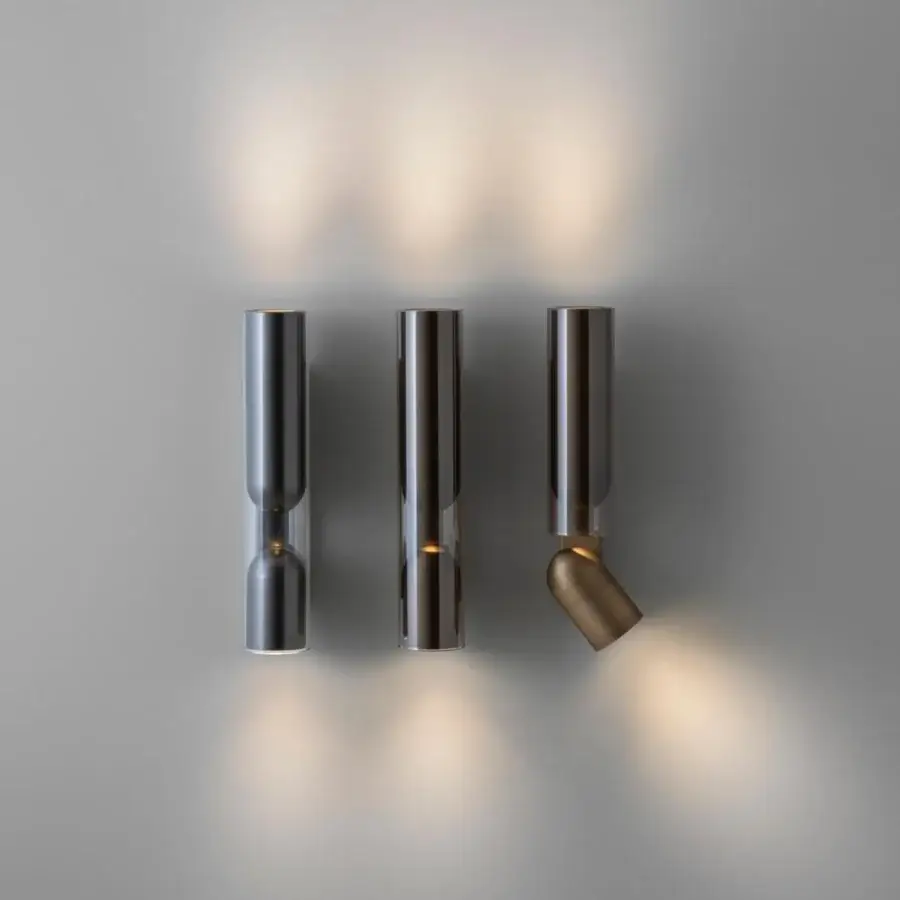 Distinguished Penta Clash wall lamp uniting glass lightness with brushed bronze crafted in a warm glow
