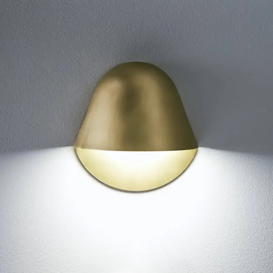 Elegant Penta Enoki wall lamp crafted in warm gold varnished metal exhibiting a minimalist teardrop silhouette with diffused light