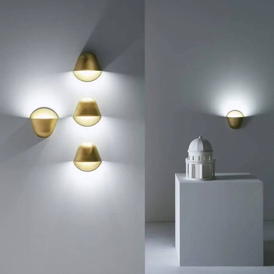 Distinguished Penta Enoki wall lamp in matt varnished metal with a minimalist form and warm brass tone