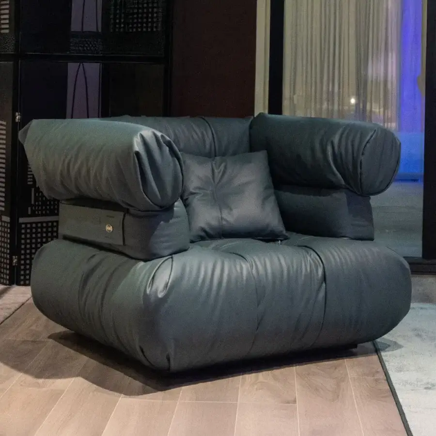 Distinctive Joker Home Collection Asylum lounge chair upholstered in textured matte leather with lasered décor