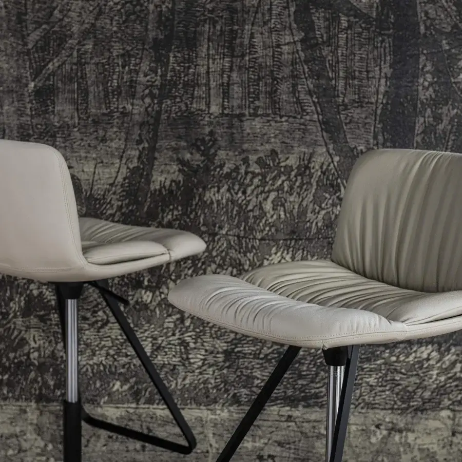 Distinguished Cattelan Italia Axel X stool with creamy-gray synthetic leather upholstery and black embossed lacquered steel base