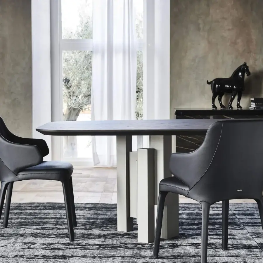 Sophisticated Cattelan Italia Skyline Wood table with a barrel-shaped Canaletto walnut top and graphite embossed lacquered steel base