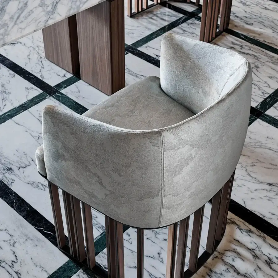 Exceptional Giorgetti Hero chair with neutral gray textured fabric upholstery and satin-finish canaletto walnut base
