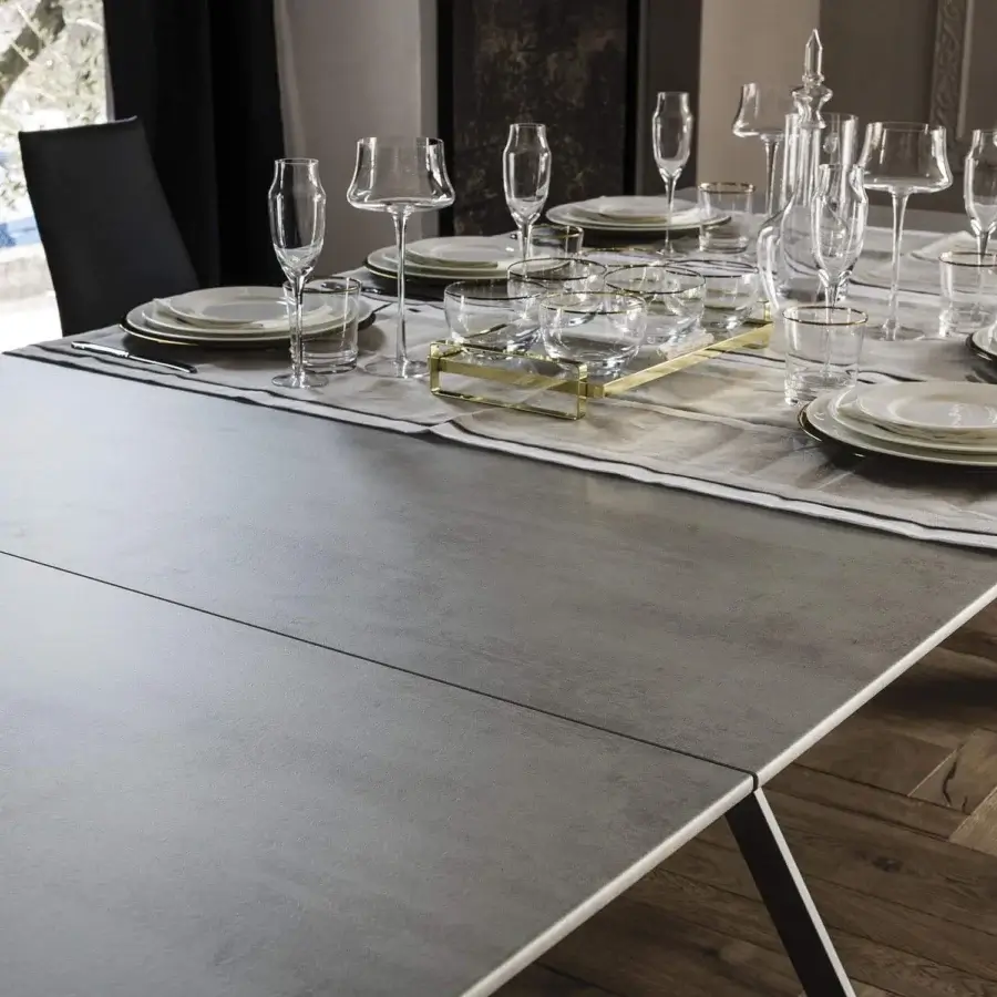 Superior Cattelan Italia Convivium console to table with medium gray cement laminated wood and graphite embossed lacquered steel base