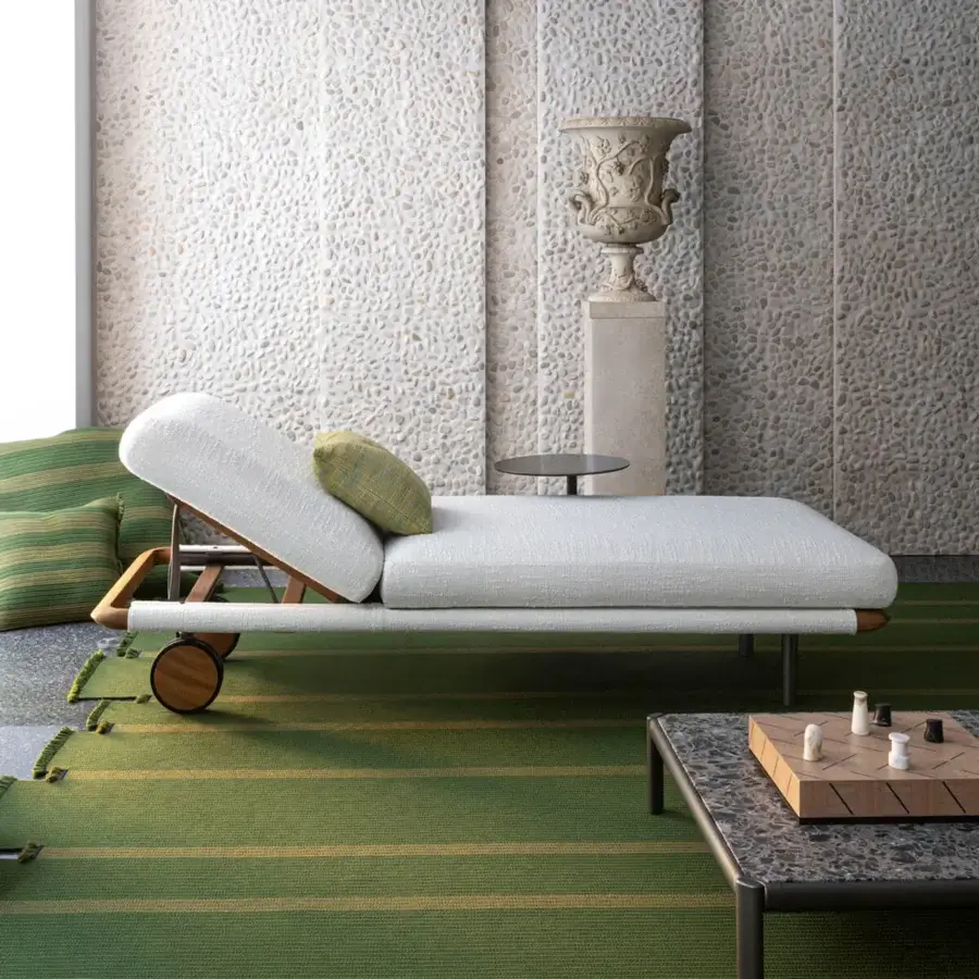 Superior Giorgetti Moorea lounger with pewter painter stainless steel frame and off-white Open-Air fabric upholstery accented with olive green