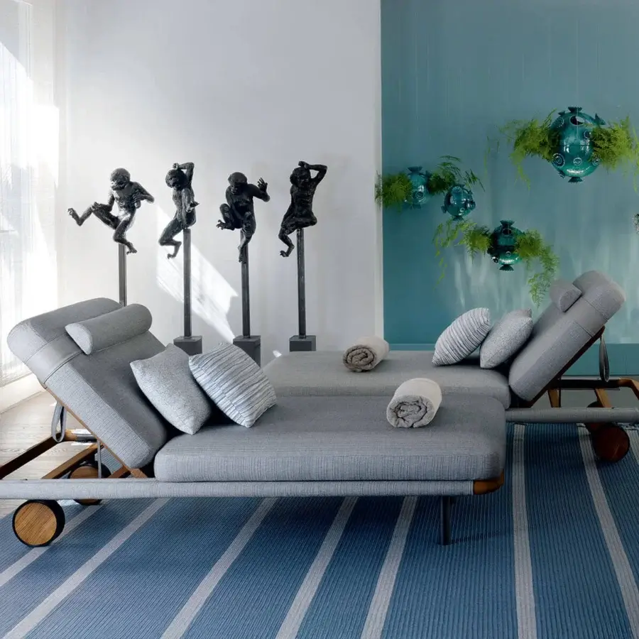Distinguished Giorgetti Moorea lounger with pewter painter stainless steel frame and medium gray woven fabric upholstery with cushions