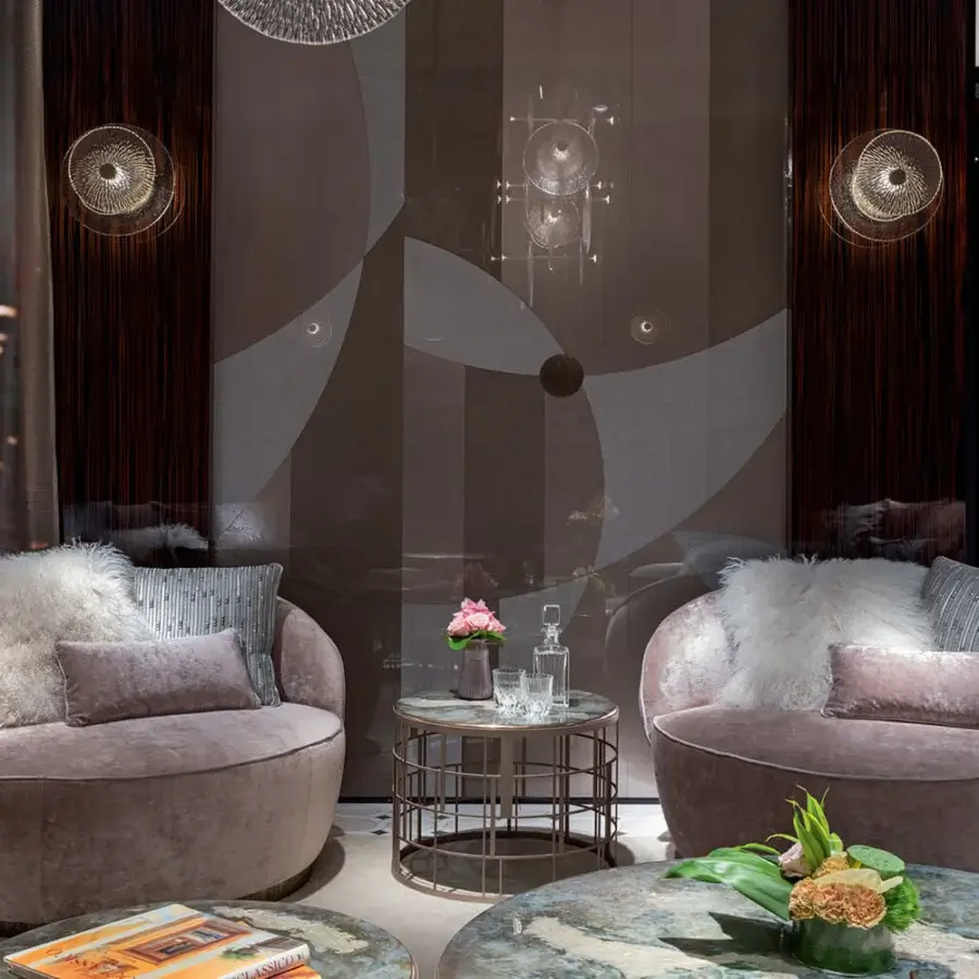 Lavish Sicis Prestige Lounge chair with enveloping oval shape upholstered in textured mauve fabric and light gray cushions