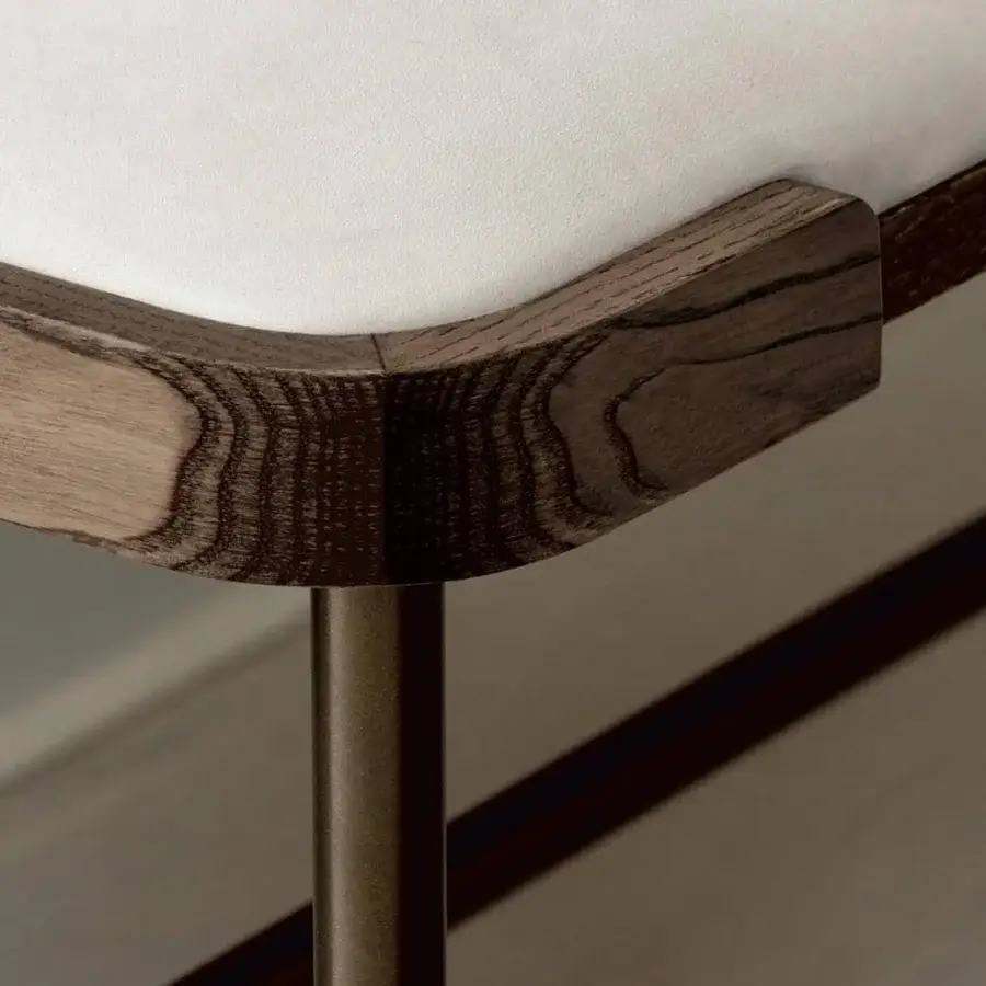 Distinguished Porada Astol bench with a bronze finished metal base and solid ash wood frame upholstered in white textile or synthetic leather