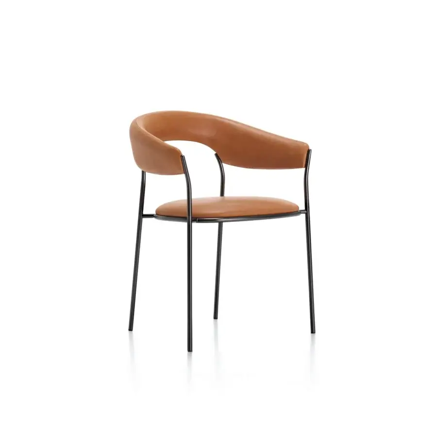 Distinguished MDF Italia Archie armchair with curved backrest and integrated armrests in warm tan textile with matte black metal legs