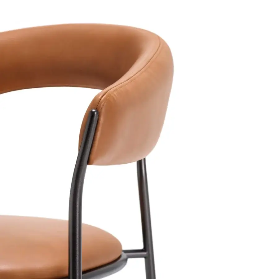 Captivating MDF Italia Archie armchair with seamless curves and integrated armrests in smooth matte synthetic material with dark metal legs