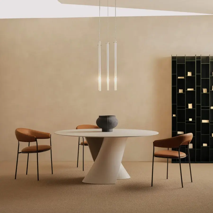 Elegant MDF Italia Archie armchair with reddish-brown textile upholstery and slender black metal legs