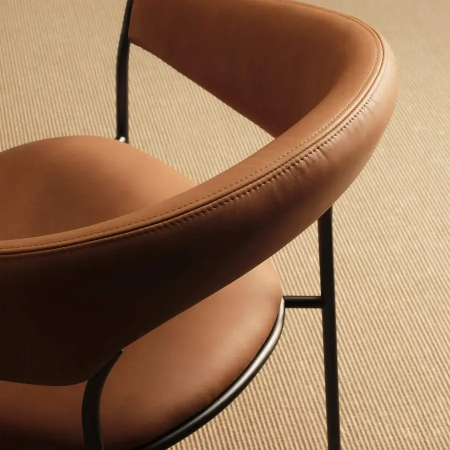 Exceptional MDF Italia Archie armchair with warm brown synthetic upholstery and matte black metal frame