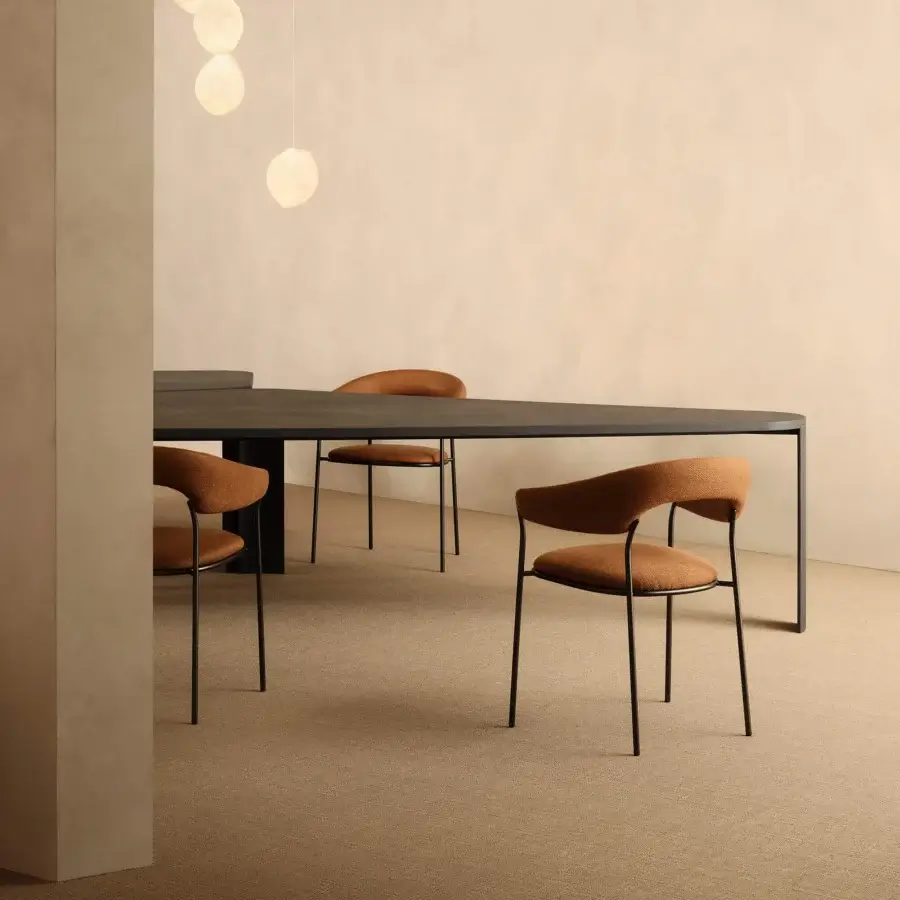 Distinguished MDF Italia Archie armchair with earthy orange-brown textured textile and refined matte finish