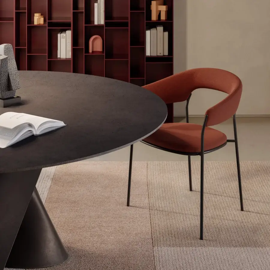 Captivating MDF Italia Archie armchair with terracotta textile upholstery and slender dark matte metal legs