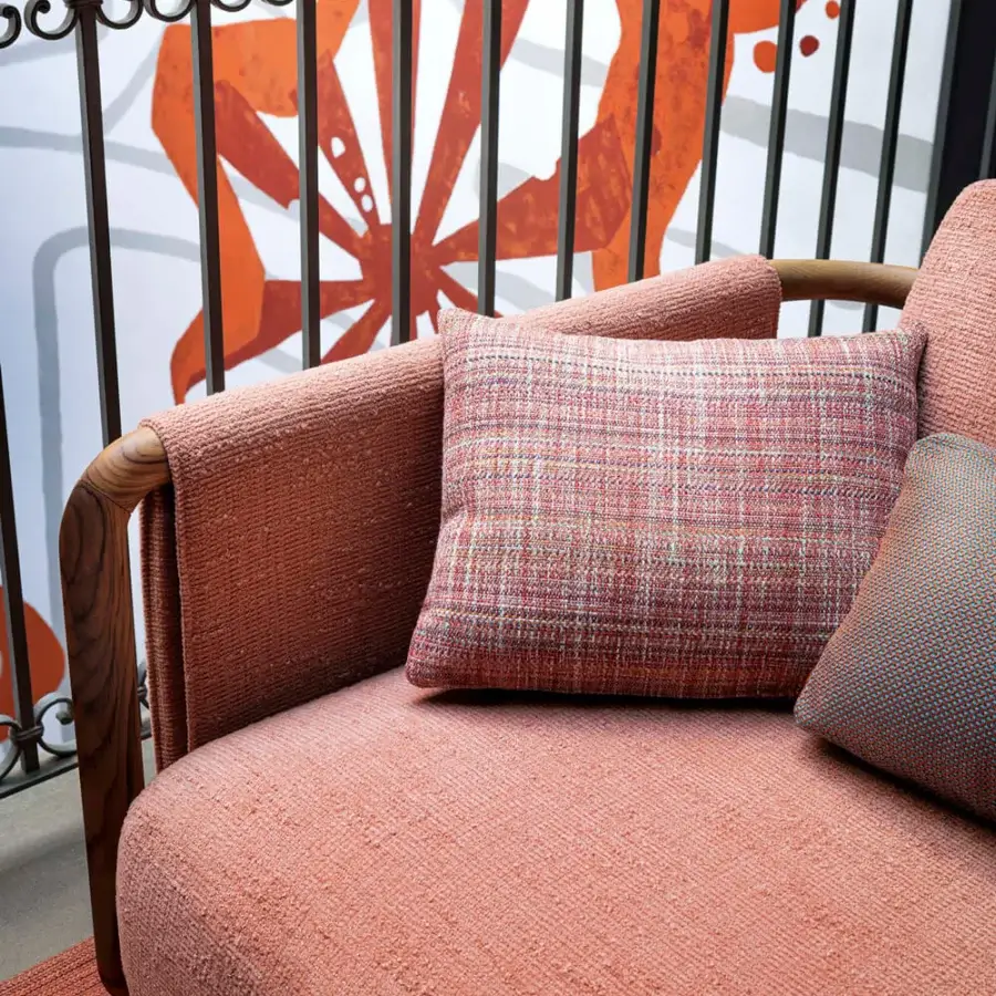 Distinguished Giorgetti Moorea sofa with a pewter painted stainless steel frame and coral-peach textured fabric upholstery