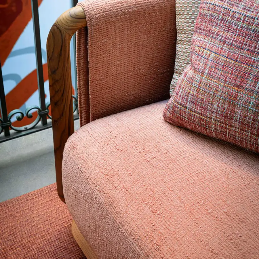 Exceptional Giorgetti Moorea sofa crafted with pewter painted stainless steel, teak inserts, and muted coral textured upholstery