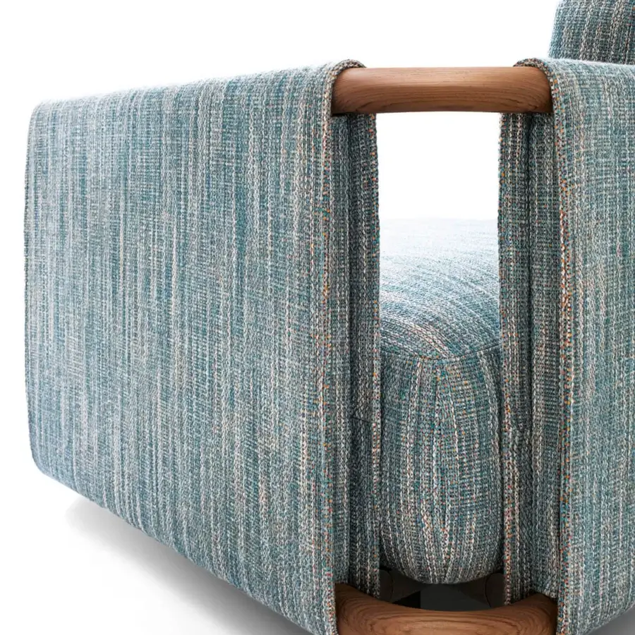 Lavish Giorgetti Moorea sofa built with pewter painted stainless steel, teak inserts, and contemporary variegated textile upholstery with satin finish