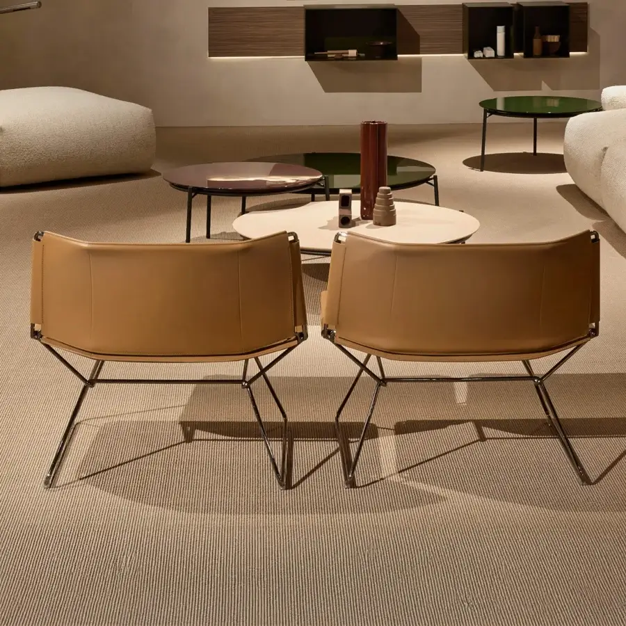 Meticulous MDF Italia Neil lounge chair crafted with full-grain leather in a warm medium brown tone with a matte finish