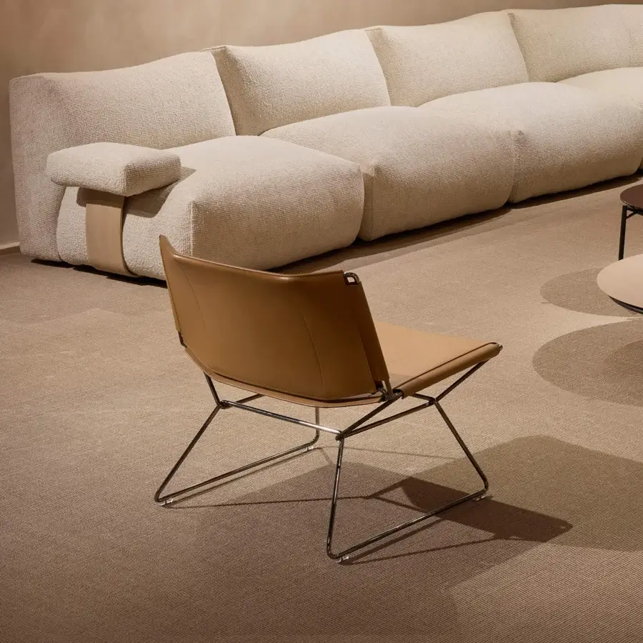 Distinguished MDF Italia Neil lounge chair with a steel wire frame and full-grain leather in a warm medium-brown finish