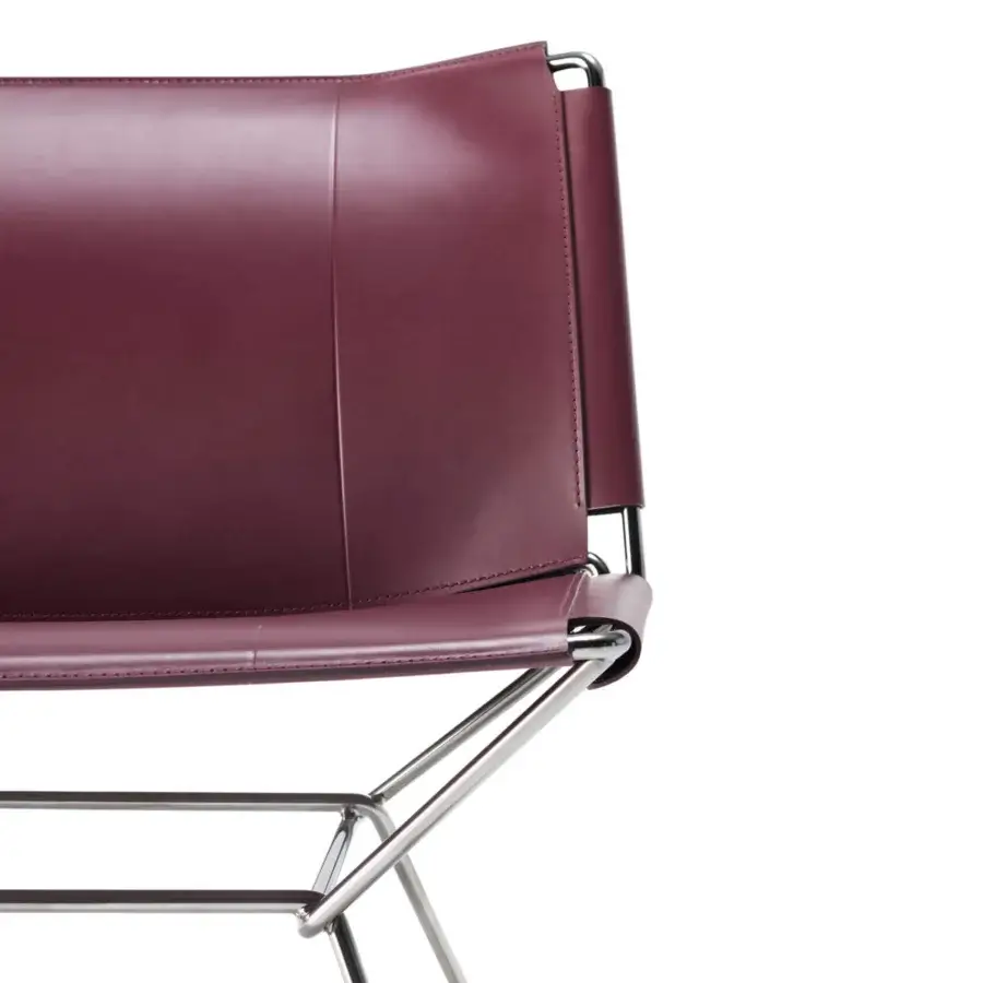 Distinguished MDF Italia Neil lounge chair crafted in burgundy full-grain leather with tone-on-tone dyed edges and embossed detailing