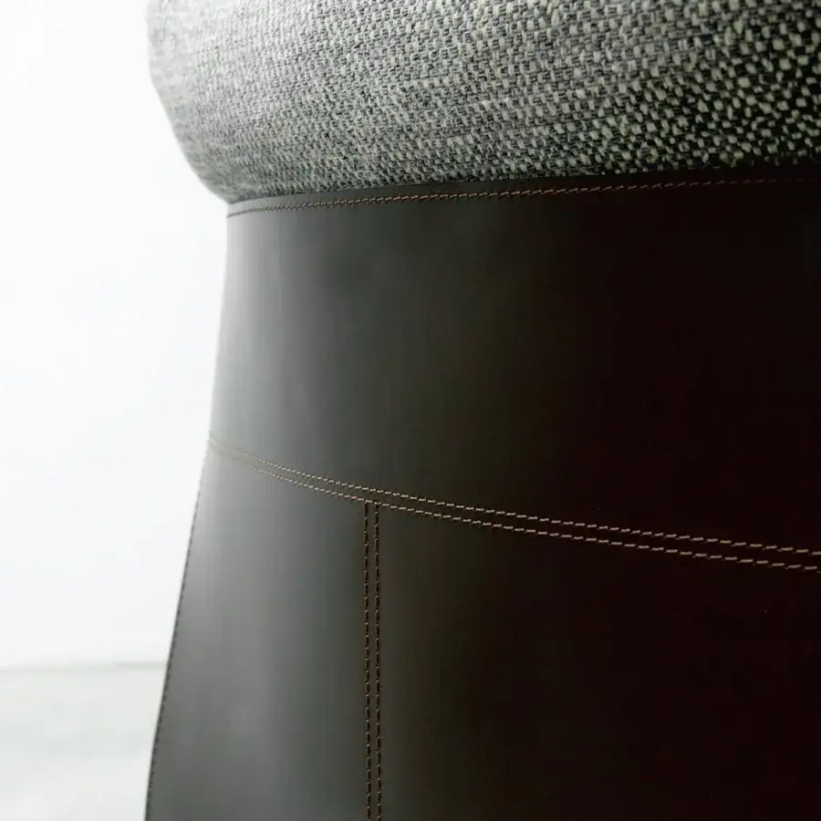 Lavish Porada Vera lounge chair with solid Canaletto walnut frame and Cuoietto leather back upholstered in gray textile