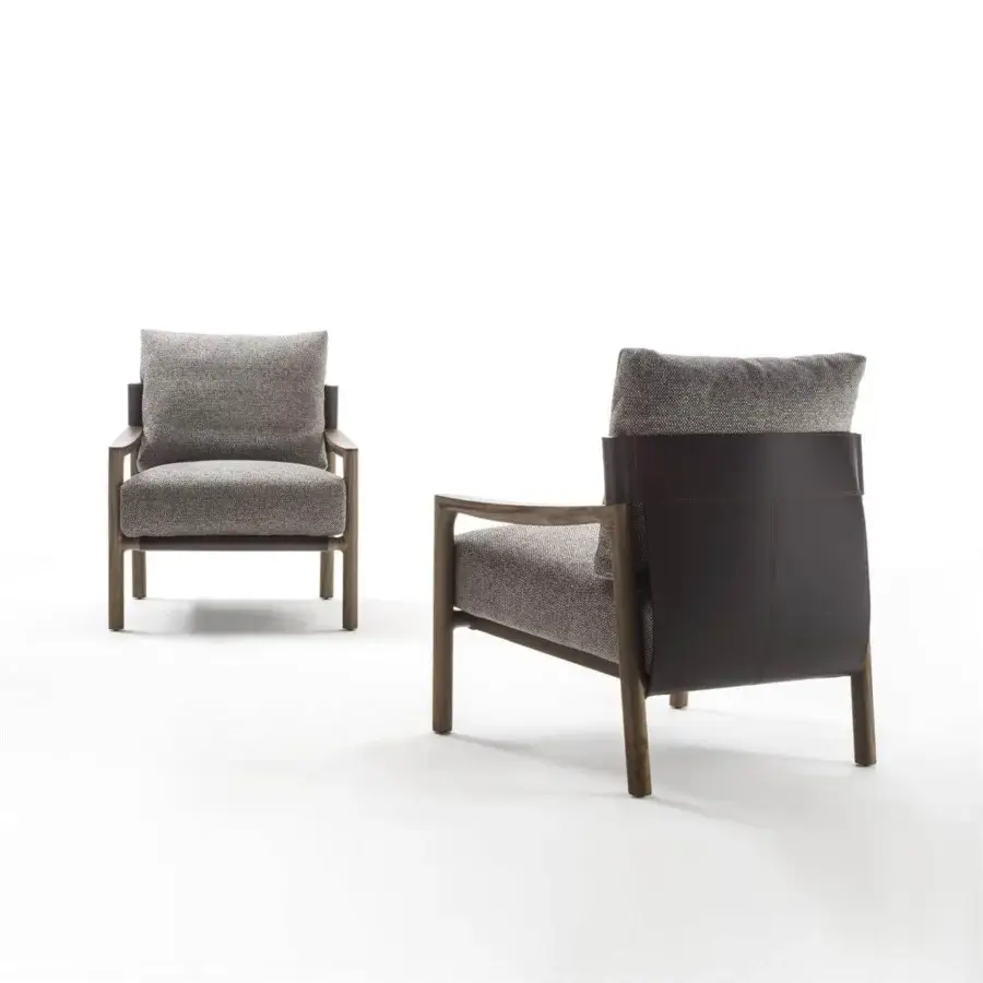 Sophisticated Porada Vera lounge chair with Canaletto walnut frame and Cuoietto leather back in gray textured fabric