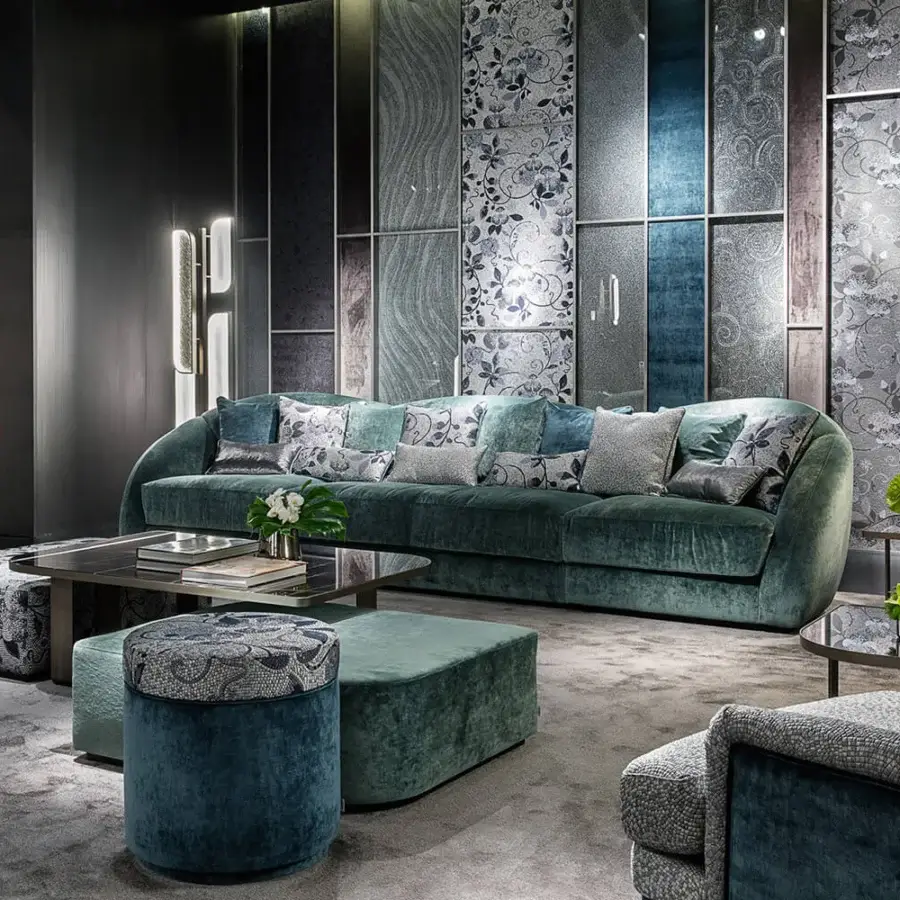 Superior Sicis Visconti sectional with a gently curved form upholstered in muted teal textured textile and lacquered wood base
