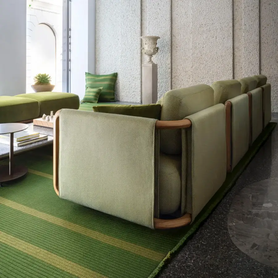 Superior Giorgetti Moorea sectional with pewter painted stainless steel, teak inserts and muted olive green Open-Air fabric upholstery