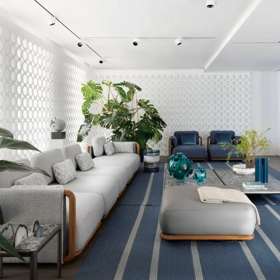 Lavish Giorgetti Moorea sectional with pewter painted stainless steel, teak inserts and textured light gray fabric upholstery