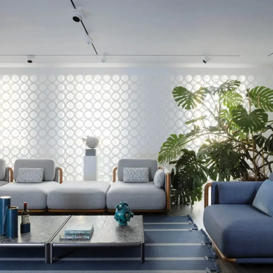 Elegant Giorgetti Moorea sectional with pewter painted stainless steel, teak inserts and muted gray-blue woven fabric upholstery