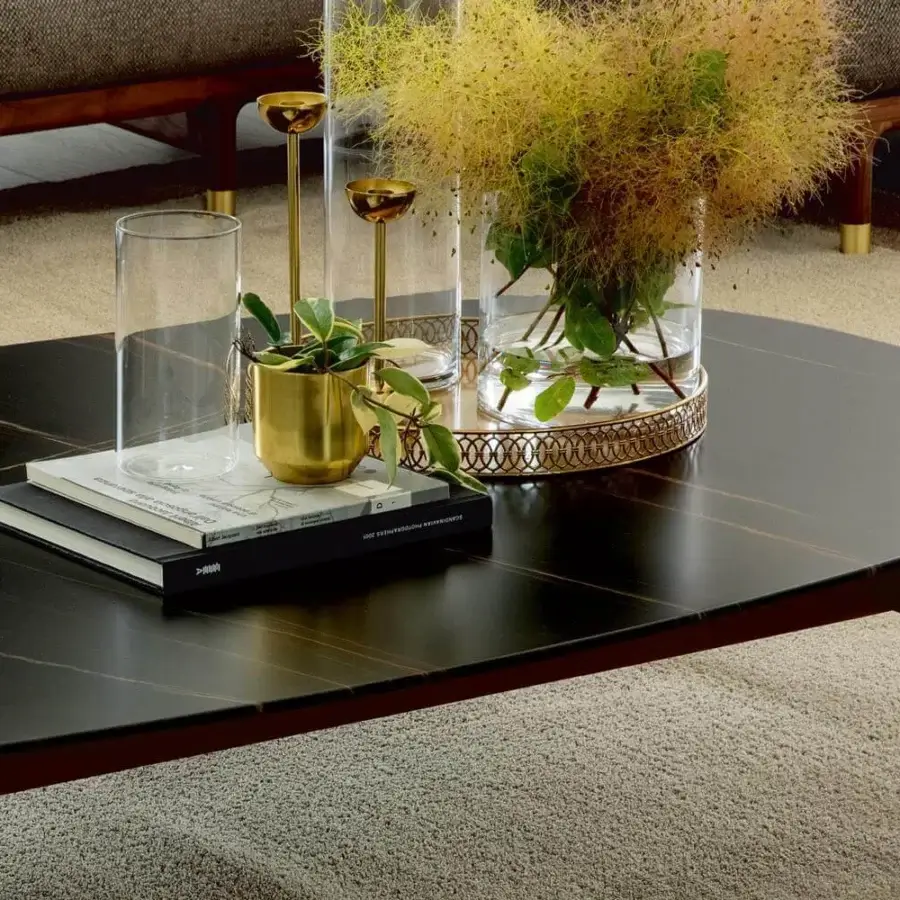 Elegant Porada Quay coffee table with glossy black marble and reddish-brown Canaletto wood built with brushed brass feet