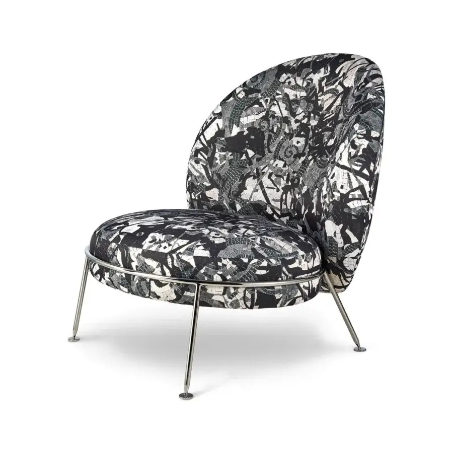Superior Sicis Amaretto art lounge chair with black and white patterned textile and bright metal legs with coated finish