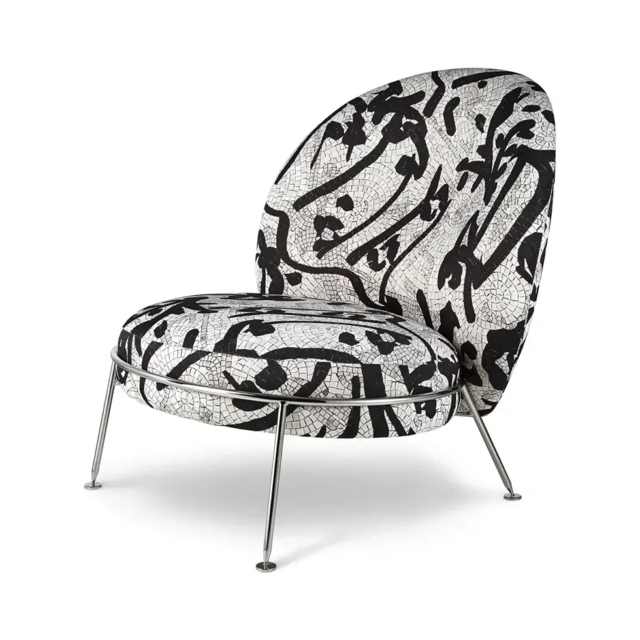 Distinguished Sicis Amaretto art lounge chair with black and white textile upholstery and sleek metal with coated finish