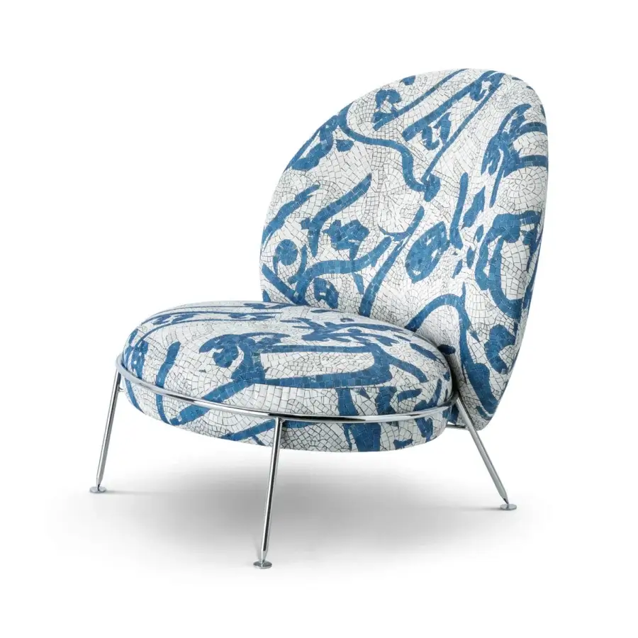 Superior Sicis Amaretto art lounge chair with blue and white mosaic textile upholstery and coated metal legs