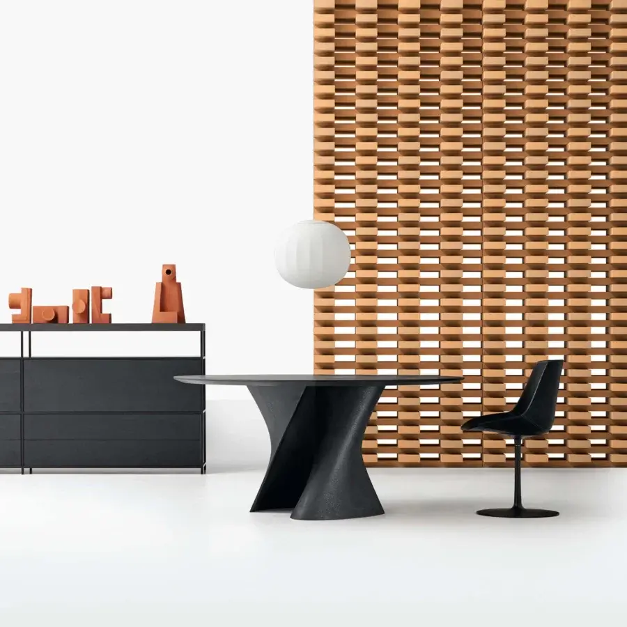 Exceptional MDF Italia S table crafted in anthracite concrete with a transparent extra-clear glass top and dynamic curves