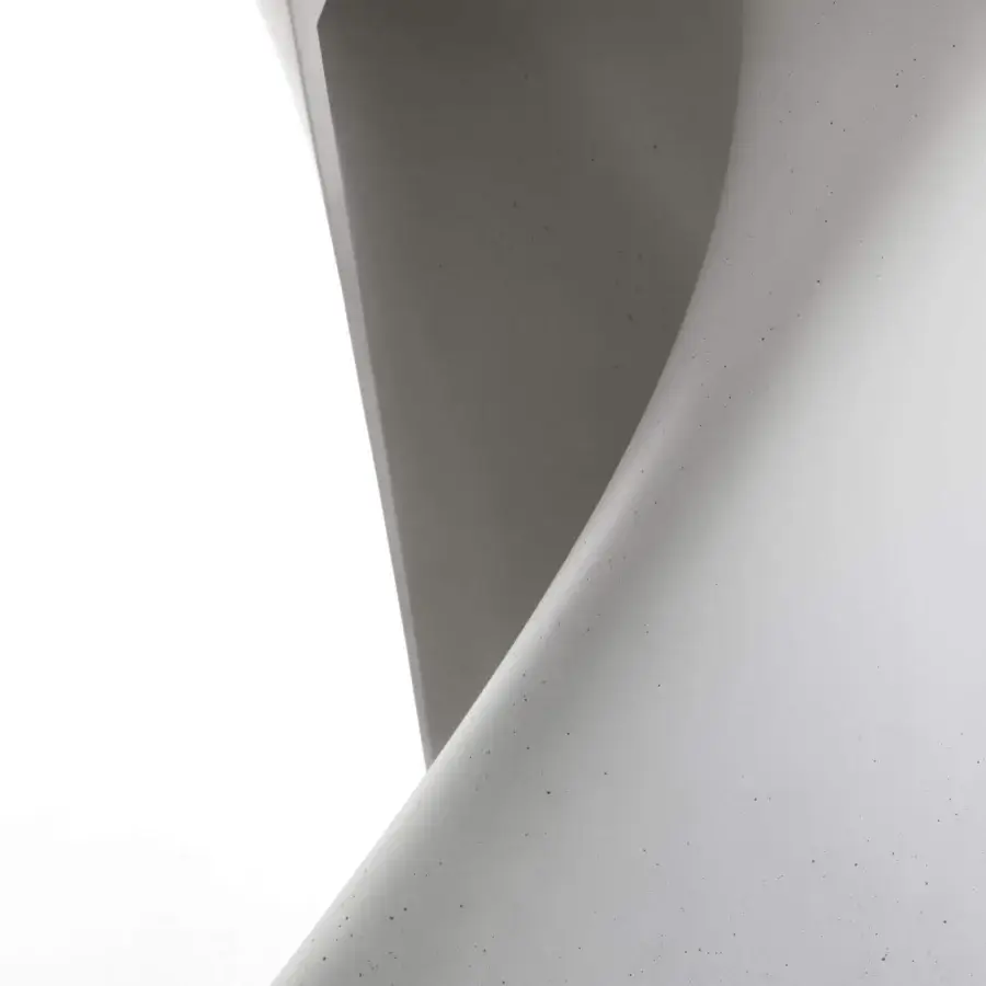 Distinctive MDF Italia S table crafted in white concrete with a matte finish and clear glass tabletop