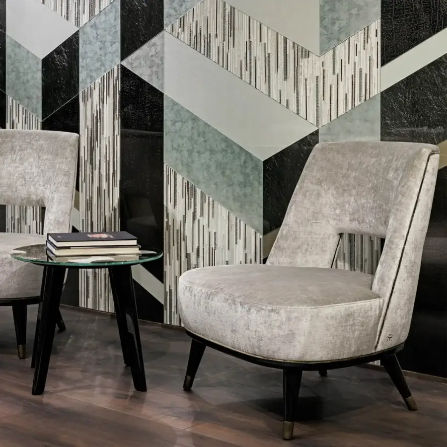 Balanced Sicis Liam lounge chair with muted gray woven textile and lacquered dark wood legs finished with metal end caps