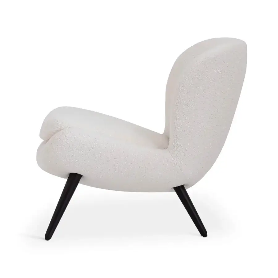 Lavish Sicis Niels lounge chair upholstered in textured off-white fabric with elegantly angled dark-toned wood legs