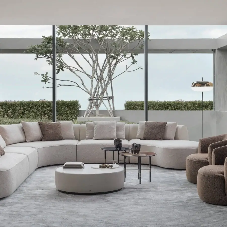 Lavish Sicis Botero sectional with generous curves upholstered in textured beige fabric and built with a solid timber frame